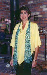 Carole, with yellow silk shirt and black pants...