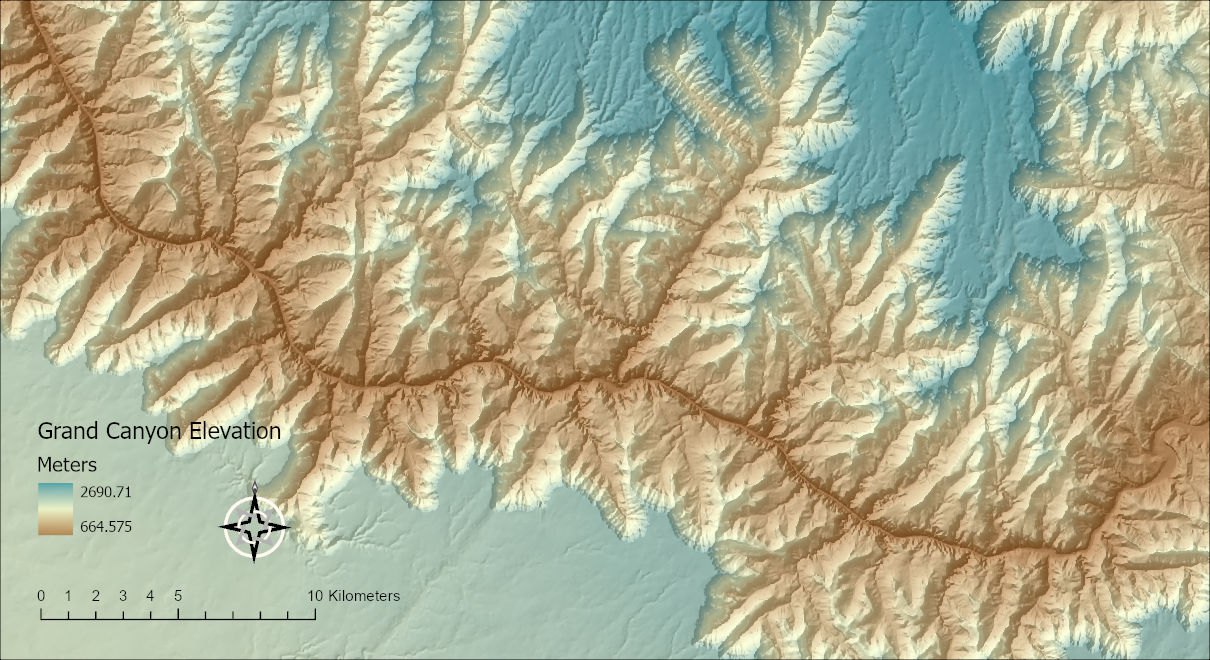 A tinted relief map of the Grand Canyon with a legend titled Grand Canyon Elevation, a compass north arrow and a 10 kilometer scale bar placed directly on the map in the lower left corner, with nothing behind them