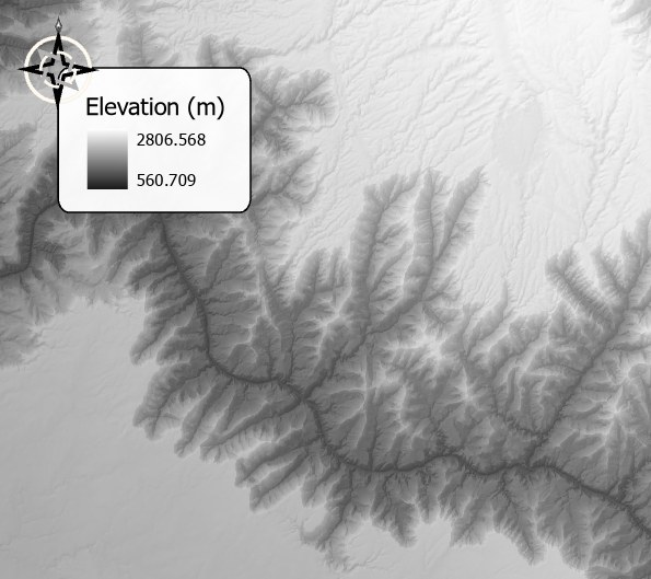A legend titled Elevation (m), with a gray ramp from 2806.568 down to 560.709, sitting on a white rounded rectangle with a dark outline over a dark gray elevation map, with a compass north arrow overlapping the rectangle's upper left corner