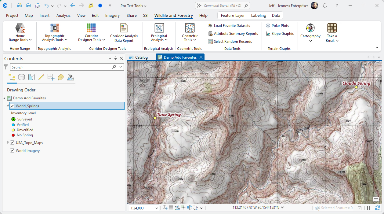 The same ArcGIS Pro map a moment later. The Contents pane now lists World_Springs, with a legend of four inventory levels, then USA_Topo_Maps, then World Imagery. The map shows a topographic map with two yellow spring points labeled Tuna Spring and Claude Spring