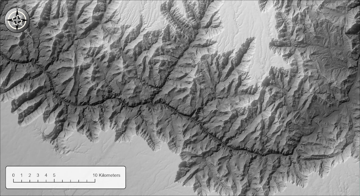 A hillshade of the Grand Canyon under a partly transparent black-to-white elevation layer with the Luminosity blend mode: the inner canyon is darkened toward charcoal and the plateaus are pale, the same picture as the Normal blend mode gives