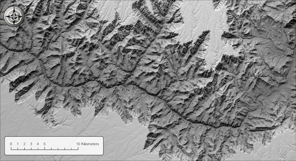 A three-sun hillshade of the Grand Canyon: relief shows on canyon walls facing every direction, the shadows are soft and partly lit, and the inner gorge is darkened toward charcoal while the plateaus stay pale