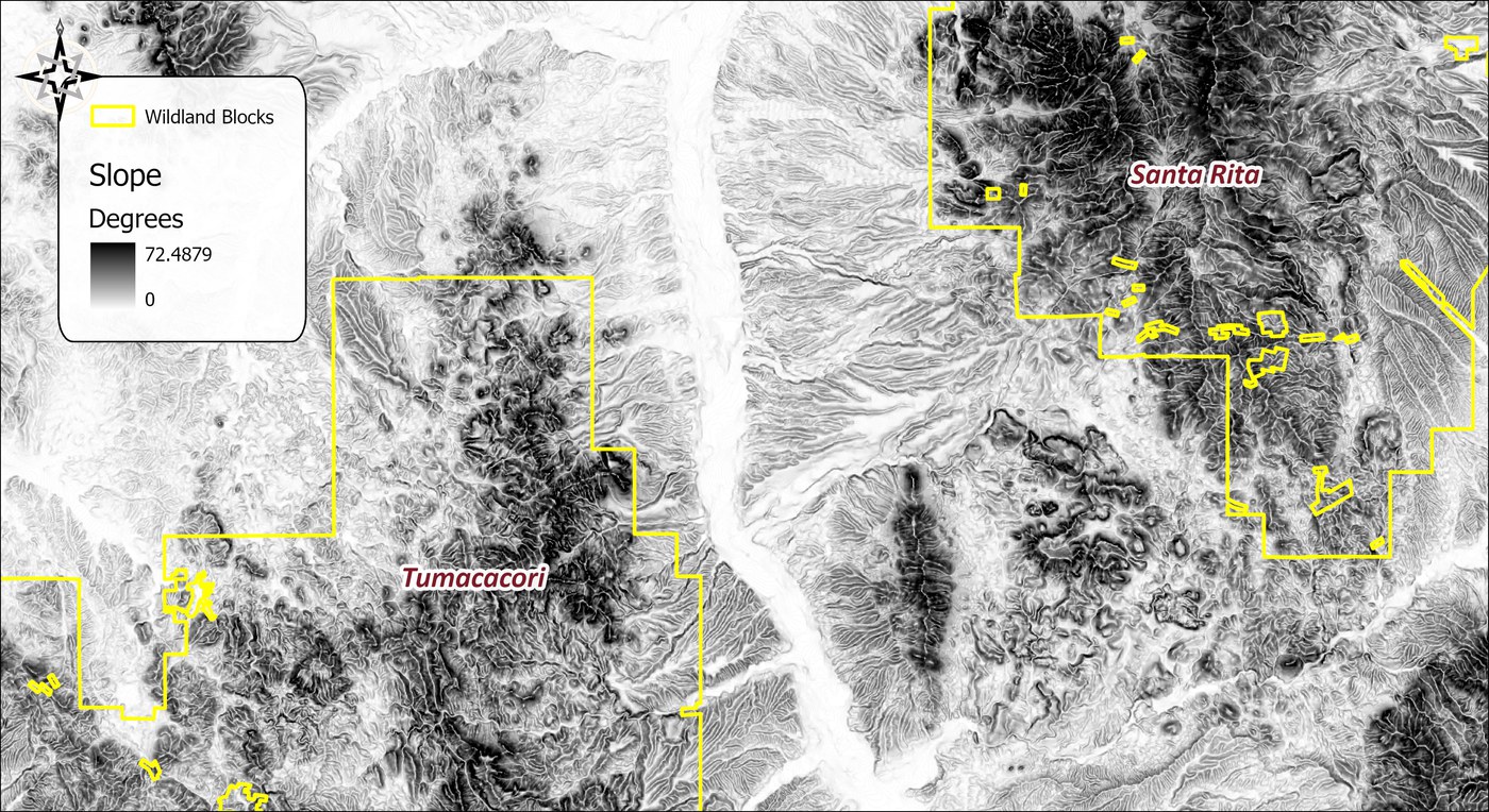 Slope in degrees over the study area, white on the flats to black on the steepest ground, with the wildland blocks outlined in yellow
