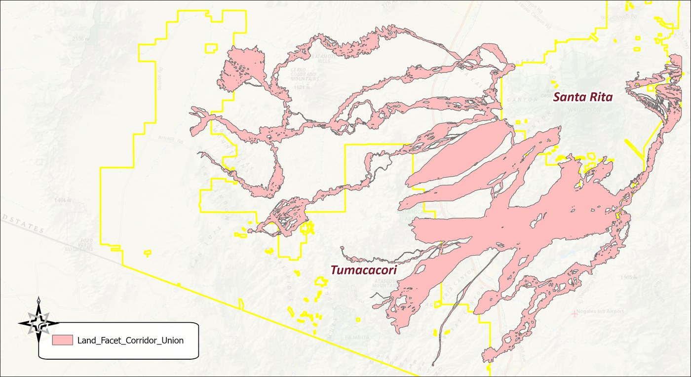 The unioned linkage design in pink over a topographic base: the nineteen 1 percent strands merged into one polygon that sprawls from the Tumacacori block north around the Cerro Colorado and Batamote hills, across the valley to the Santa Rita block, and south along the mountains toward Nogales, with many small holes and slivers, and the wildland blocks outlined in yellow