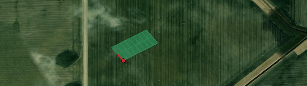 An aerial photograph of a crop field with a small block of green plot rectangles previewed at an angle, a red dot at the block's corner and a short red line showing the plot direction